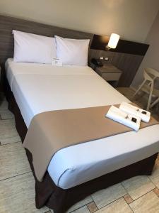 Letto o letti in una camera di Hotel Mega