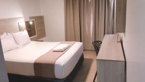 Letto o letti in una camera di Hotel Mega