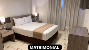 Letto o letti in una camera di Hotel Mega