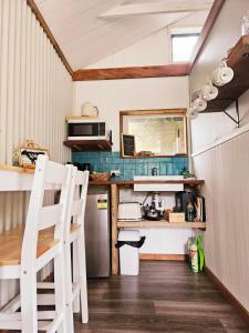 a kitchen in a tiny house with a counter at The Barn, Nungurner in Nungurner +8 photos