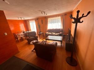 an overhead view of a living room with a couch at Marimo in Futaleufú