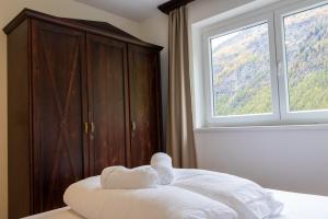 Posteľ alebo postele v izbe v ubytovaní International House Sölden Apartment mit Terrasse ZW 9