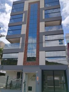 a rendering of a building with glass windows at Refúgio em Palmas in Governador Celso Ramos