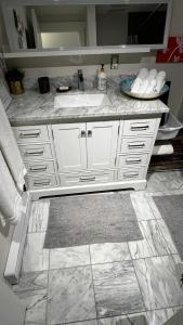 a bathroom with a white sink and a mirror at ALL NEW 2BR Loft in Chilliwack +21 photos
