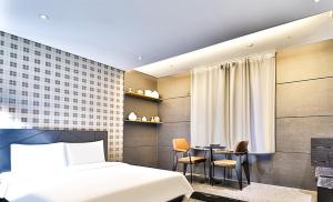Postel nebo postele na pokoji v ubytování Ignis Hotel