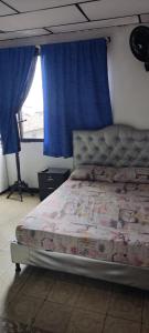 Ένα ή περισσότερα κρεβάτια σε δωμάτιο στο Hotel Eje Cafetero