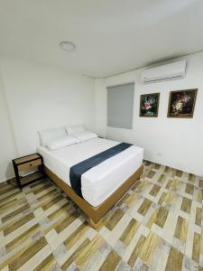Postel nebo postele na pokoji v ubytování Hotel Estadio 80