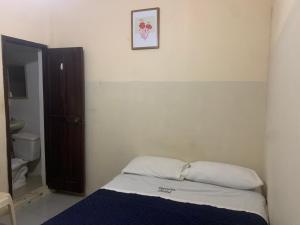 Postel nebo postele na pokoji v ubytování Veranera Hostal