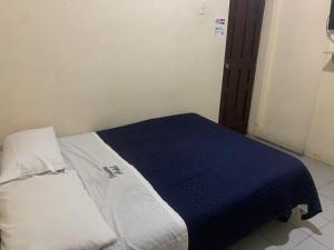 Postel nebo postele na pokoji v ubytování Veranera Hostal
