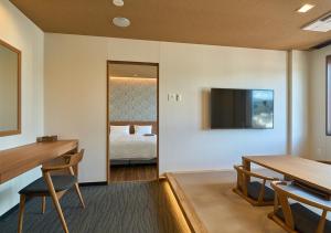 Postel nebo postele na pokoji v ubytování Hotel and Spa Gift TAKAYAMA