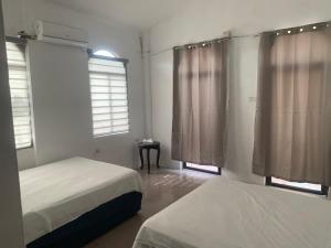 Postel nebo postele na pokoji v ubytování Veranera Hostal