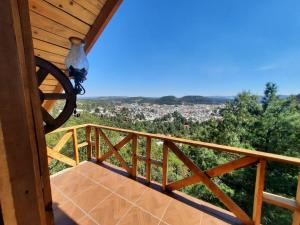 a view from the balcony of a cabin with a view at Cabañas Los Cascabeles in Creel