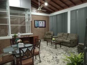 a living room with a couch and a table at Villa Shendel in Gampaha