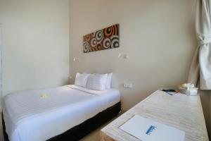Postel nebo postele na pokoji v ubytování Villa Nakula Suites