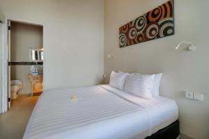 Postel nebo postele na pokoji v ubytování Villa Nakula Suites
