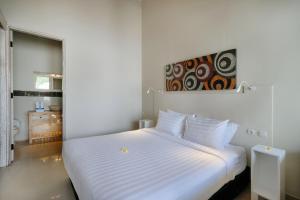 Postel nebo postele na pokoji v ubytování Villa Nakula Suites