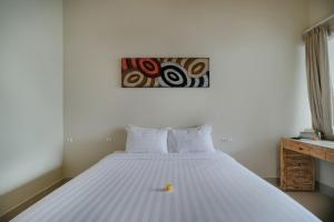 Postel nebo postele na pokoji v ubytování Villa Nakula Suites