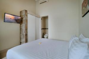 Postel nebo postele na pokoji v ubytování Villa Nakula Suites
