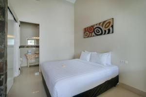 Postel nebo postele na pokoji v ubytování Villa Nakula Suites