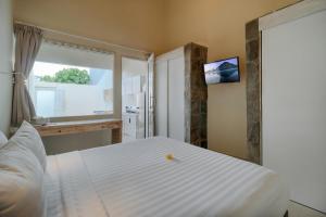 Postel nebo postele na pokoji v ubytování Villa Nakula Suites