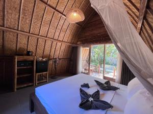 MoonBag Bungalows客房内的一张或多张床位