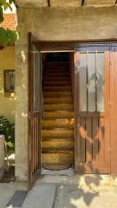 an open door to a stairway with a set of stairs at Refugio Mendoza in Godoy Cruz