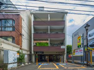 an empty parking lot in front of a building at Tokyo Stay Akasaka in Tokyo