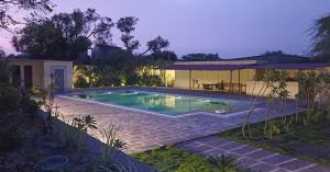 a swimming pool in the backyard of a house at Fort Chabariya in Kekri