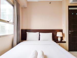 Ένα ή περισσότερα κρεβάτια σε δωμάτιο στο Best Deal 2BR Apartment at Mekarwangi Square Cibaduyut By Travelio +23 φωτογραφίες