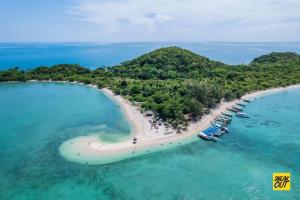 an aerial view of a beach with boats in the water at Cat Ba Madame Duyen Hotel in Cat Ba