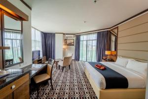Ein Bett oder Betten in einem Zimmer der Unterkunft Adya Hotel Langkawi