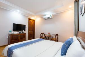 Postel nebo postele na pokoji v ubytování CAMY Hotel Vung Tau