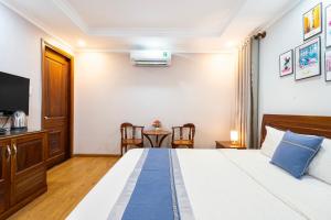 Postel nebo postele na pokoji v ubytování CAMY Hotel Vung Tau