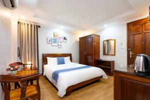 Postel nebo postele na pokoji v ubytování CAMY Hotel Vung Tau