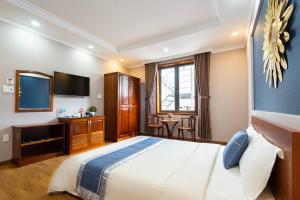 Postel nebo postele na pokoji v ubytování CAMY Hotel Vung Tau