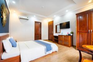 Postel nebo postele na pokoji v ubytování CAMY Hotel Vung Tau