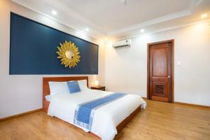 Postel nebo postele na pokoji v ubytování CAMY Hotel Vung Tau