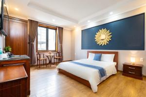 Postel nebo postele na pokoji v ubytování CAMY Hotel Vung Tau