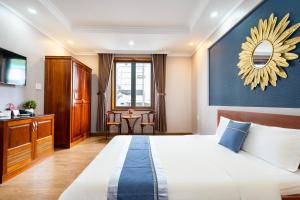 Postel nebo postele na pokoji v ubytování CAMY Hotel Vung Tau