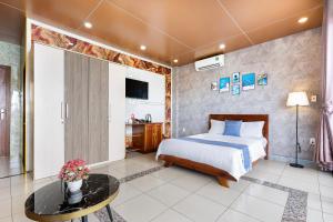 Postel nebo postele na pokoji v ubytování CAMY Hotel Vung Tau