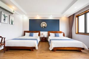 Postel nebo postele na pokoji v ubytování CAMY Hotel Vung Tau