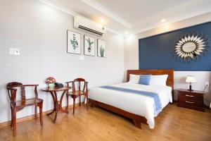 Postel nebo postele na pokoji v ubytování CAMY Hotel Vung Tau