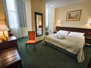 Posteľ alebo postele v izbe v ubytovaní EA Hotel Downtown