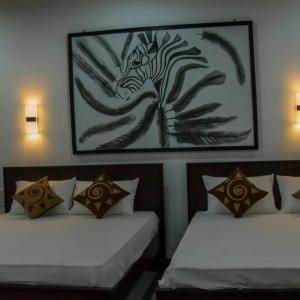 Ένα ή περισσότερα κρεβάτια σε δωμάτιο στο GOLDEN TEMPLE VILLA ,Nilaveli Rd, Trincomalee