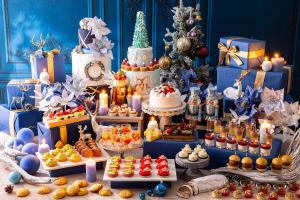 a christmas party with cakes and desserts and a christmas tree at Conrad Tokyo in Tokyo