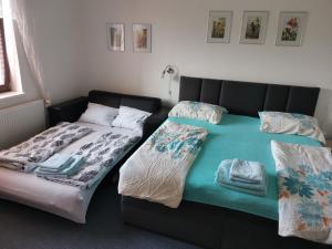 Voodi või voodid majutusasutuse Apartmán Absolon toas