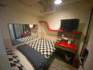 Postel nebo postele na pokoji v ubytování 香港九巴旅馆 KMB-Guesthouse