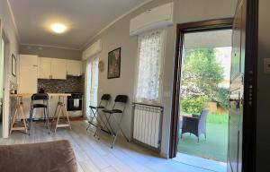 a kitchen with a table and chairs in a room at Casina dei Gemelli in Rome +13 photos
