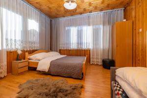 Postel nebo postele na pokoji v ubytování Dom na Podhalańskiej