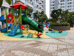 a playground in a city with a slide at Comfy and Modern Wonderful 2BR Apartment at Tanglin Supermall Mansion By Travelio in Surabaya